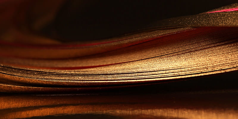 Detailed close-up of a stack of papersused in Australian Public M&A Deal Report 2026 Chapter Competition Regime.