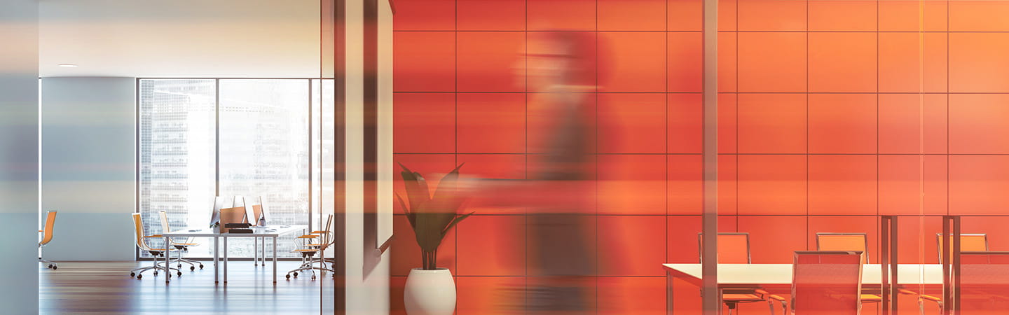 A blurred image of an office space used in Ashurst's developments in employment law.